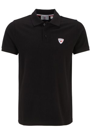 Polo shirt nera in cotone, con una patta a tre bottoni e una toppa con logo sul lato sinistro del petto, caratterizzata da un leggero motivo testurizzato.