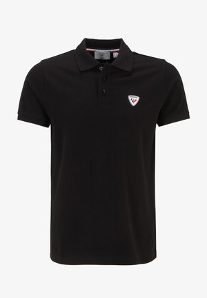 Schwarzes Polohemd aus Baumwolle mit einer Drei-Knopf-Leiste und einem Logopatch auf der linken Brust, ergänzt durch ein dezentes strukturiertes Muster.