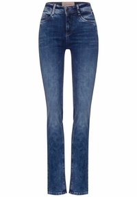 Mörkblå denimjeans med slim fit, utrustade med fem fickor, knappstängning och diskreta sömdetaljer längs sömmarna.
