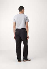 Puma BETTER CLASSICS PANTS - Broek - black