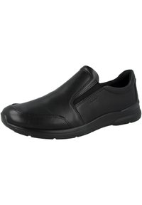Schwarzer Leder- Slipper mit elastischen Seitenteilen, abgerundetem Zehenbereich und strukturiertem Gummisohle, ausgestattet mit dezenten Nähdetails.