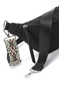 Black suede bag with zip closure, featuring a detachable strap with a geometric pattern in black, red, and cream. Silver hardware accents.