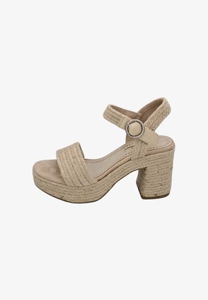 Sandales à plateforme beiges avec texture tressée, large bride sur les orteils, bride de cheville réglable et design à talon carré.