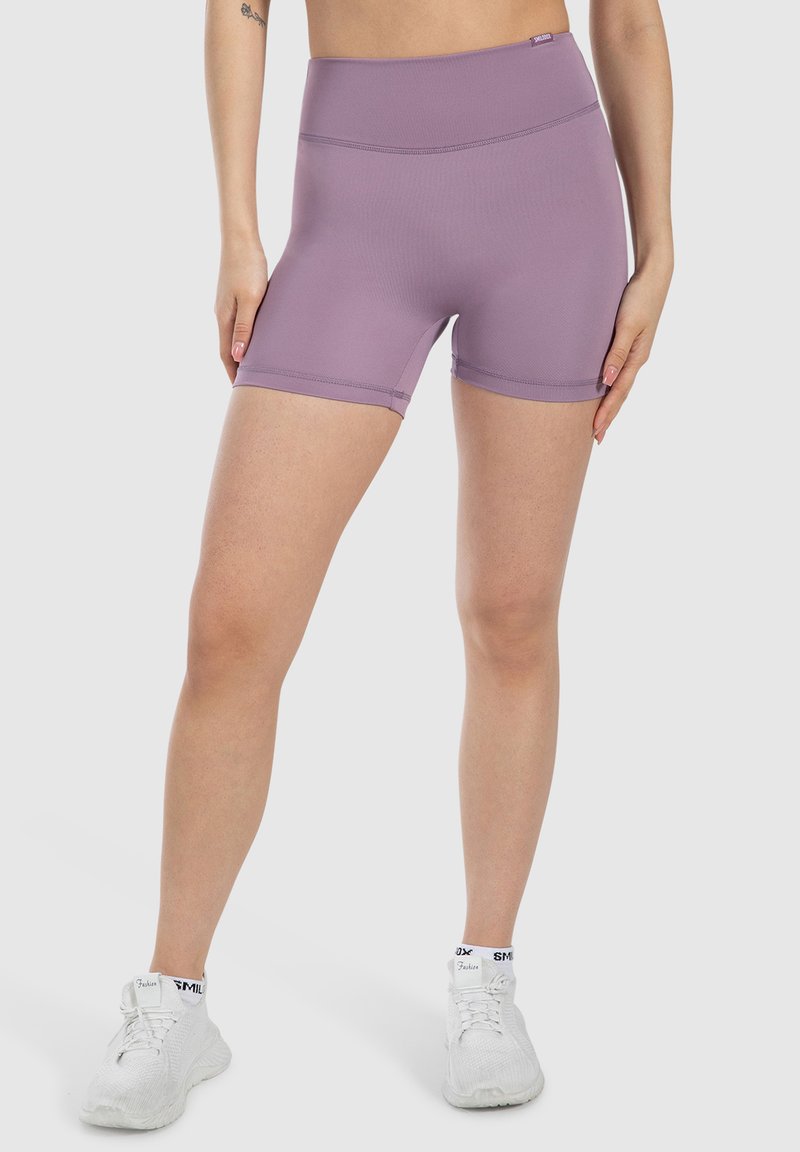 Pantaloni sportivi viola realizzati in tessuto elastico, con una cintura alta e un design senza cuciture per il massimo comfort. Lunghezza corta e aderente con una superficie liscia.