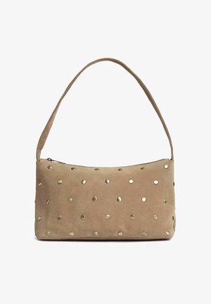 Small beige suede handbag with a single strap, zipper closure, and scattered round brass studs on the front.
