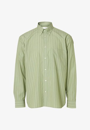 Lys grønn stripete skjorte med krage som kan kneppes, lange ermer, brystlomme og hvite knapper. Laget av mykt stoff.