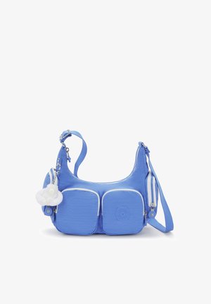 Borsa a spalla in tessuto blu con due tasche frontali, dettagli bianchi, tracolla regolabile e charm a forma di pompon bianco attaccato.