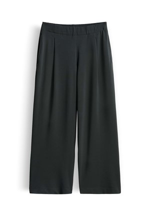 Zwarte wijde cropped broek met elastische tailleband en zijzakken, plat gelegd op een witte achtergrond.