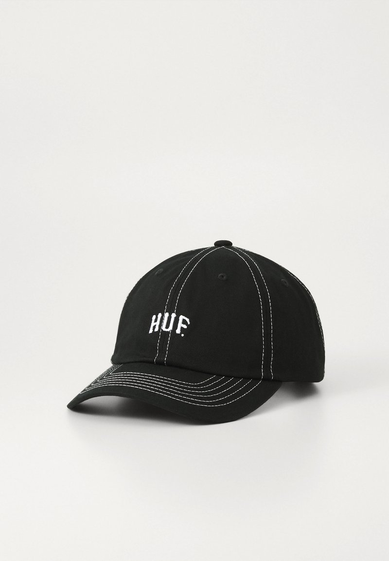 Black baseball cap made of cotton, features white stitching, curved brim, and 'HUF.' embroidered on the front. Six-panel structure.