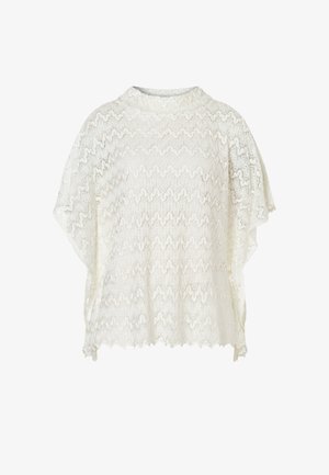 White lace poncho with scalloped edges and intricate floral pattern, short sleeve design, and high round neckline.
