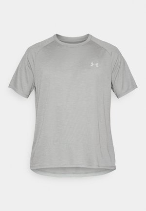 Lys grå atletisk kortermet skjorte med rund hals, teksturert stoff og en liten logo på øvre venstre side.