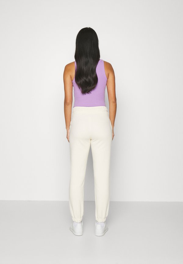 TONAL SHIELD - Tracksuit bottoms - linen2