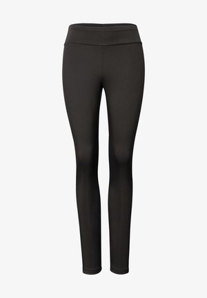 Leggings negros hechos de un material elástico y suave. Presentan un diseño de talle alto y un acabado sin costuras a lo largo de las piernas.