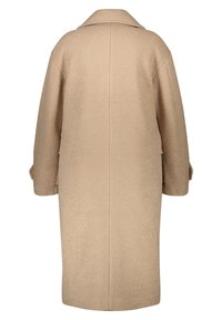 Beige uldfrakke med en afslappet pasform, lange ærmer og krave. Har en glat tekstur og en lige ryg uden ekstra hardware.