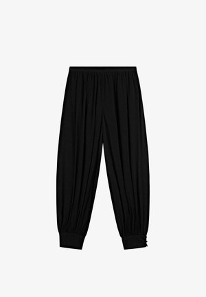 Czarne, elastyczne spodnie o luźnym kroju, z marszczonymi mankietami i pionowymi plisami dodającymi strukturę. Lekka tkanina.