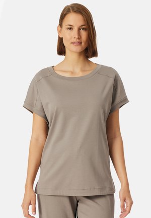 T-shirt en coton gris à manches courtes retroussées, col rond et coupe décontractée. Texture lisse et détails de couture minimalistes.