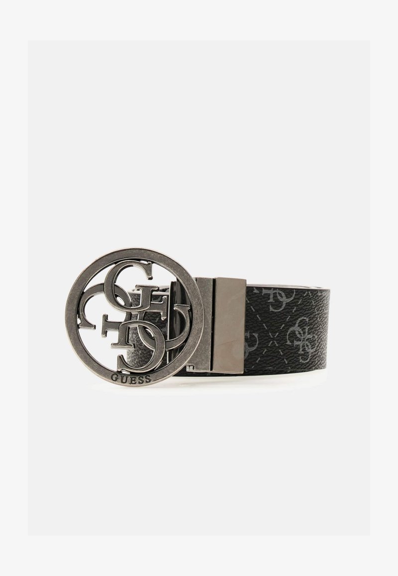 Ceinture Guess en cuir noir avec une boucle ronde en argent ornée d'un logo design représentant les lettres entrelacées G, U, E, S.