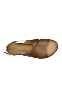 Brown leather sandal with crossover straps, open toe, and a small side zip. Smooth texture and flat sole with subtle stitching detail.