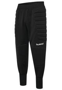 Svarta träningsbyxor med texturerad stoppning på sidorna, elastisk midja och åtsittande muddar. Har en logotyp på underbenet.