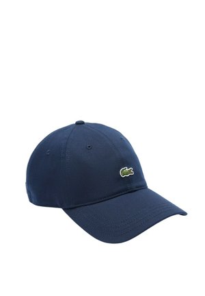 Cappellino da baseball blu navy con visiera curva e logo del coccodrillo verde sul davanti a sinistra, su sfondo bianco semplice.