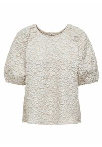 Blouse crème à manches courtes avec motif floral texturé et col rond, présentant des manches légèrement bouffantes et des poignets élastiques.