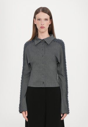 Gray button-up shirt featuring pointed collar, textured puff sleeves, and a cropped fit. Smooth fabric with a subtle sheen.