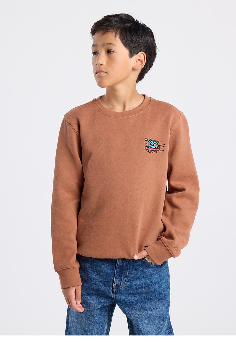 Brown cotton sweatshirt with a crew neckline and long sleeves. Features a colorful skateboarding graphic on the left chest.