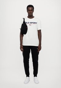 Polo Ralph Lauren ATHLETIC UNISEX - Calças de fato de treino - black/white