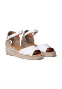 Witte espadrille wedge sandalen met een geweven jute hak, open teen ontwerp, verstelbare enkelband en een soepel leren bovenwerk.