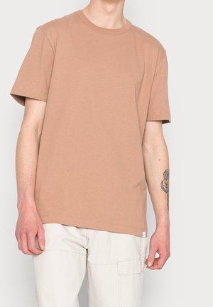Brown cotton t-shirt with short sleeves and a round neckline, featuring a relaxed fit and subtle stitching detail.