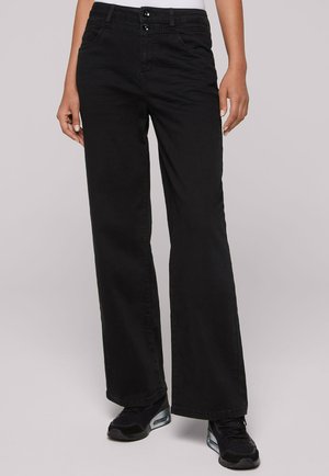 WIDE - Flared Jeans - black