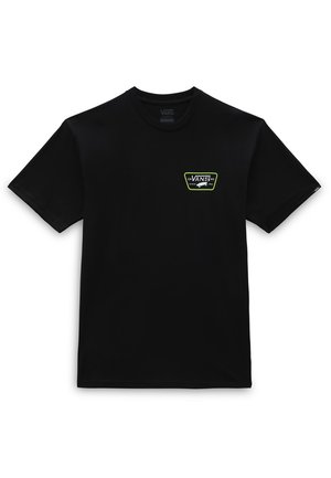 Camiseta negra de manga corta con cuello redondo, con un pequeño logo de Vans delineado en verde y un gráfico de monopatín en el pecho izquierdo.