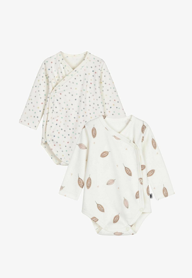 Två långärmade babybodys: en vit med flerfärgade prickar, den andra vit med bruna lövmönster. Båda har omslagsdesign.
