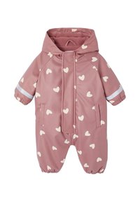 Pink waterproof overall with white heart patterns, a hood, elastic cuffs, and a front zipper. Features reflective accents and side pockets.