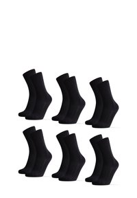 Calcetines de algodón negros en un paquete de seis, de longitud media, con textura suave, puño acanalado en la parte superior, de forma uniforme para mayor comodidad y ajuste.