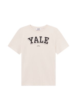 T-shirt de algodão bege claro com mangas curtas e decote redondo. Texto preto em negrito "YALE" impresso ao longo do peito em estilo arqueado.