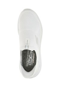 White knit slip-on sneaker with textured surface, padded collar, and branded insole. Features a grey patterned interior and elastic side accents.