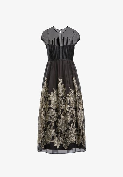 Fekete ruha áttetsző, felső ujjal és pliszírozott mellszárral. A szoknya bonyolult arany virágmintával hímzett tüll overlay-t tartalmaz.