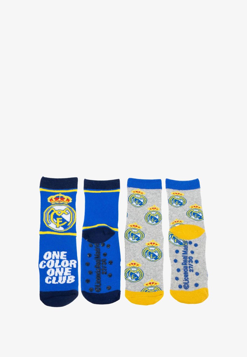 Zestaw czterech skarpet w niebiesko-szarym kolorze, z logotypami Real Madryt, wzorami oraz gumowymi punktami grip na spodach.