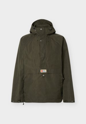 Dark green hooded outdoor jacket with front flap, snap buttons, drawstrings, and centered small rectangular brand logo patch.