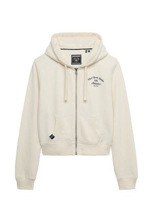 Kremowa bluza z kapturem na zamek, z przednimi kieszeniami, sznurkiem w kapturze oraz napisem „New York State 1986 Athletics" na piersi.