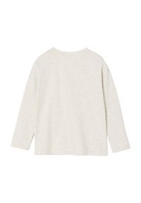 Light gray long-sleeve top in a soft, textured fabric with a round neckline and side slits for ease of movement. Simple, unadorned design.