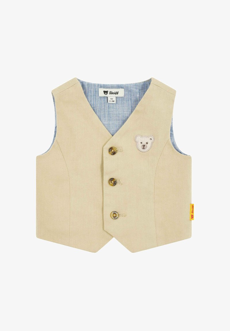 Beige gilet met een V-hals, drie gouden knopen, een berenmotief en chambray voering met horizontale strepen. Voorzien van een geel labeltag.