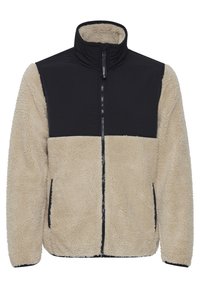 Fleecejack met een tan gekleurde sherpa-bovenkant en een zwarte nylon bovenrug. Volledige rits aan de voorkant en zijzakken met textielstof.