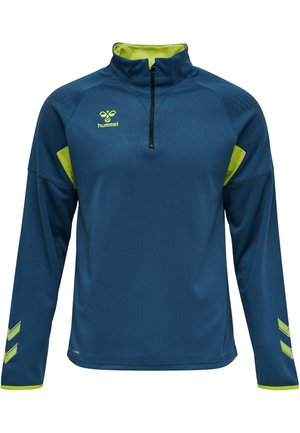 Blå kvartdraget huvtröja med gröna accenter. Texturerad tyg med små prickiga mönster. Hummel-logotyp på bröstet och chevrondetaljer på ärmarna.