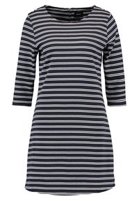 Mörkblå och vit randig klänning med trekvartslånga ärmar, rund halsringning och dragkedja bak. Tillverkad av ett mjukt, stretchy material.