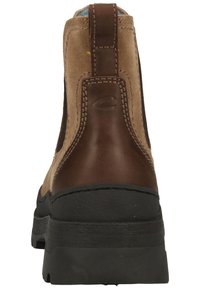 Brown suede and leather ankle boot with a black rubber sole. Features a pull tab at the back and visible stitching along the seams.