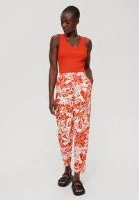 s.Oliver Tracksuit bottoms - dunkelorange