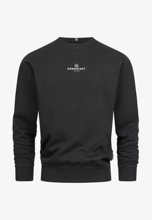 Felpa nera in tessuto morbido. Presenta un colletto rotondo, polsini e orlo a costine. Testo del logo bianco al centro.