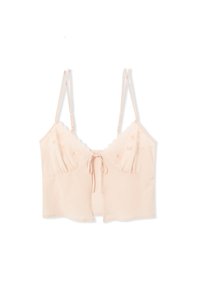 Bralette rosa chiaro con spalline sottili regolabili, bordi scallop, ricamo floreale sui coppe e un dettaglio a fiocco frontale.